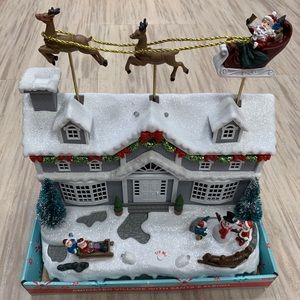 Animated village with santa’s sleigh